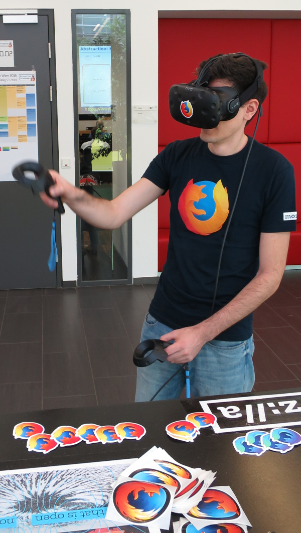VR Headset user with Mozilla logos